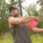 Ben Boettger/Peninsula Clarion Kyle McCowan leans into a throw during a disc golf tournament at Tsalteshi Trails on Saturday, July 25.