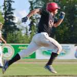 Ben Boettger/Peninsula Clarion Oilers catcher Brent Diaz streaks toward first base in a game against the Mat Su Miners on Saturday, August 1 at the Kenai Oilers baseball field in Kenai.