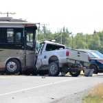 Photo by Megan Pacer/Peninsula Clarion  Two people are dead and the Kenai Spur Highway is closed after a wreck between an RV and a truck on Wednesday August 5, 2015 in Kenai, Alaska. Authorities are asking that people who need to travel between Kenai and Soldotna take Kalifornsky Beach Road.