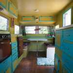 This Friday, July 17, 2015 photo shows the inside of  Deanna Wohlgemuth's vintage Aristocrat camper in Vancouver, Wash.   Wohlgemuth's dubbed the camper "Matilda," which is a 1963 16-foot Aristocrat camper she rescued from the junk heap, she now rents it our for camping and events. (Natalie Behring/The Columbian via AP) MANDATORY CREDIT