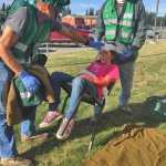 Photo by Megan Pacer/Peninsula Clarion Community Emergency Response Team course members Charles See (left) and John Eller (right) prepare to treat 11-year-old Kellee Martin for fake injuries during a simulated earthquake exercise held Saturday Aug. 8, 2015 at Soldotna Prep School in Soldotna, Alaska.