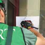 Photo by Megan Pacer/Peninsula Clarion Jeremiah Millette, a member of the Kenai Peninsula Borough's most recent Community Emergency Response Team class, labels the front door of Soldotna Prep as he and other classmates begin an earthquake simulation at the end of the course. The exercise was held on Saturday, Aug. 8, 2015 at Soldotna Prep School in Soldotna, Alaska.