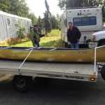 Courtesy Photo/Kenny Merkes Sterling Resident Tommy Patterson (left) speaks with an Alaska Wildlife Trooper (right) before the canoe used by two men in an attempted boat motor theft Monday night was impounded, on Tuesday Aug. 11, 2015 in Sterling, Alaska.