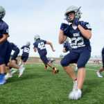 Photo by Rashah McChesney/Peninsula Clarion  Jace Urban, junior runs into position during a drill on Thursday August 13, 2015 during a Soldotna High School football practice in Soldotna, Alaska.