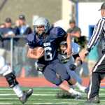 Ben Boettger/Peninsula Clarion Soldotna High School football player  runs with the ball during a game at Soldotna High School on August 16.