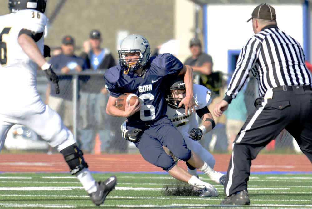 Ben Boettger/Peninsula Clarion Soldotna High School football player  runs with the ball during a game at Soldotna High School on August 16.
