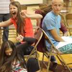 Photo by Kelly Sullivan/ Peninsula Clarion (Left) Cassie Haeg, Jayden Kemp and Jacob Wile make it to the final rounds in musical chairs Wednesday, Aug. 19, 2015, at Soldotna Prep in Soldotna, Alaska.