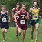 Soldotna's Aaron Swedberg, left, and Seward's Hunter Kratz, right, prepare to pass a pair of Grace Christian runners during the Colony Invitational Aug. 15 at Colony High School in Palmer. Kratz won the boys varsity race.