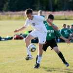 Photo by Rashah McChesney/Peninsula Clarion  Cook Inlet Academy's Connor Leaf takes control of the ball during a game against Delta Junction on Thursday August 20, 2015 in Kenai, Alaska.
