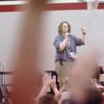 Ben Boettger/Peninsula Clarion Sterling Elementary Denise Kelly holds up a pom-pom, given as a reward to students for good behavior, while students awarded poms-poms on the first day of school raise their hands during  an assembly at Sterling Elementary School on Wednesday, August 19.