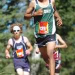 Ben Boettger/Peninsula Clarion Colony High School varsity runner Luke Mellor approaches a downhill stretch of the race course during the Tsalteshi Invitational Cross Country race at Skyview High School on Saturday, August 22.