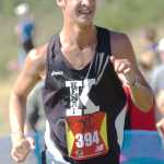 Ben Boettger/Peninsula Clarion Kenai Central High School runner Ithaca Bergholtz approaches the finish line of the Tsalteshi Invitational cross-country race at the Skyview High School on Saturday, August 22.