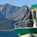 Photo by Rashah McChesney/Peninsula Clarion  President Barack Obama addresses a crowd of media at the Seward City Dock before embarking on a tour of the Kenai Fjords National Park on Tuesday Sept. 1, 2015 in Seward, Alaska.