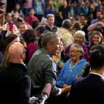 President Barack Obama greets members of the audience after delivering remarks at Kotzebue School, Wednesday, Sept. 2, 2015, in Kotzebue, Alaska. Obama is on a historic three-day trip to Alaska aimed at showing solidarity with a state often overlooked by Washington, while using its glorious but changing landscape as an urgent call to action on climate change. (AP Photo/Andrew Harnik)