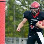 Photo by Rashah McChesney/Peninsula Clarion Kenai Kardinals' Andrew Wellborn celebrates after running a 68-yard touchdown  on Friday Sept. 4, 2015 during the team's game against Houston in Kenai, Alaska.