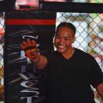 Photo by Rashah McChesney/Peninsula Clarion  Baybe Fanene waves to the audience before her fight on Saturday Sept. 5, 2015 during the Peninsula Fighting Championships mixed martial arts fights at the Peninsula Center Mall in Soldotna, Alaska.