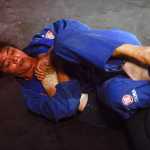 Photo by Rashah McChesney/Peninsula Clarion  Mae Britton gets a hold of Elisabeth Clay's foot during their exhibition on Saturday Sept. 5, 2015 for the Peninsula Fighting Championships mixed martial arts fights at the Peninsula Center Mall in Soldotna, Alaska.