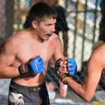 Photo by Rashah McChesney/Peninsula Clarion  Felix Bobby and Cole Aquino greet before their fight on Saturday Sept. 5, 2015 at the Peninsula Center Mall in Soldotna, Alaska.