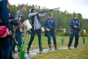 Photo by Rashah McChesney/Peninsula Clarion ...., of Eagle River, laughs as Elaina Spraker coaches her through shooting trap on Tuesday Sept. 8, 2015 at the Snowshoe Gun Club in Kenai, Alaska.