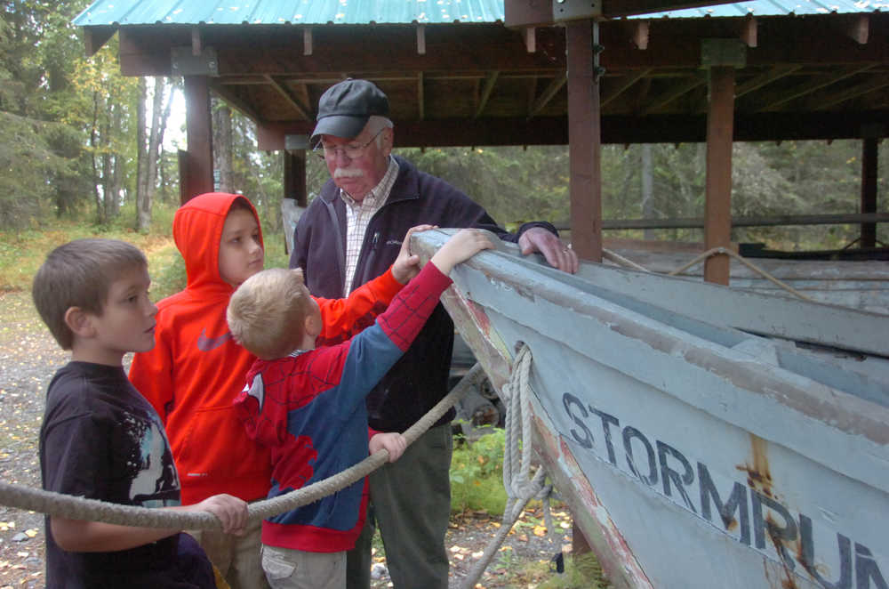 Photo by Megan Pacer/Peninsula Clarion Volunteer Paul Moses teaches children from a Soldotna Elementary third grade class about a boat named "Stormrunner" during their field trip on Thursday, Sept. 10, 2015 at the Soldotna Homestead Museum in Soldotna, Alaska.