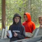 Photo by Megan Pacer/Peninsula Clarion From left to right: Connor Kniceley, 8, Vann Poage, 8, and Justice Aseltine, 8, get a closer look at a boat named "Stormrunner" during the field trip on Thursday, Sept. 10, 2015 at the Soldotna Homestead Museum in Soldotna, Alaska.