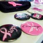 Photo by Megan Pacer/Peninsula Clarion Buttons, hats, sunglasses, neckalces, shirts and more were on sale at the Kenai Peninsula's inaugural Making Strides Against Breast Cancer Walk/Run on Sunday, Sept. 13, 2015 at the Tsalteshi Trails in Soldotna, Alaska. Proceeds from the event went to the American Cancer Society and to local patient programs.