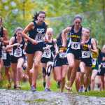 Photo by Rashah McChesney/Peninsula Clarion  Kenai's Riana Boonstra, Soldotna's Olivia Hutchings and Homer's Megan Pitzman lead the pack during the girls varsity race at the Kenai Peninsula Borough's cross country championships on Tuesday Sept. 15, 2015 in Soldotna, Alaska.