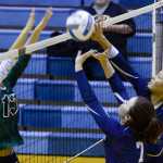 Photo by Rashah McChesney/Peninsula Clarion  Soldotna's Makenna Rosin and Lindsey Wong block a spike during their game against Colony High School on Thursday Sept. 17, 2015 in Soldotna, Alaska.