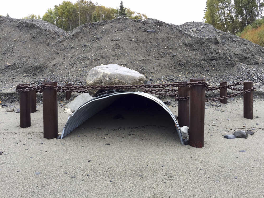Photo by Rashah McChesney/Peninsula Clarion  Private residents on properties along Kalifornsky Beach Road have constructed their own drainage solutions to deal with high water in the area including this one that belongs to a property owner who constructed a pipe to divert water pouring in from a large storm drain on the east side of the road under his property on the west side of the road and onto the beach bordering the Cook Inlet.