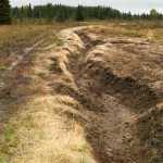 Photo by Rashah McChesney/Peninsula Clarion  Remnants of hastily constructed diversions for high water  can be found criss-crossing the fields and roads along Kalifornsky Beach Road where flooding and high water caused a disaster declaration for the area in 2013. The borough and residents in the area have sparred about potential solutions for future flooding events in the years since.