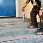 Angelica Haakenson holds her baby sister Brayleigh at Chpaman School in Anchor Point Tuesday. Angelica is back in class after losing her legs in a 2014 auto accident. Photo by Elizabeth Earl/Peninsula Clarion)