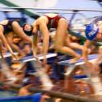 Ben Boettger/Peninsula Clarion Swimmers dive into the pool during the Soldotna Pentathlon at Soldotna High School on Friday, Sept. 26.