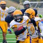 Photo by Rashah McChesney/Peninsula Clarion  Lathrop's Ricardo Henry takes off with the ball during a game against Soldotna on Saturday Sept. 26, 2015 in Soldotna, Alaska.