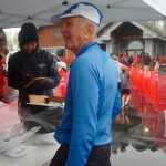 Photo by Megan Pacer/Peninsula Clarion Soldotna resident Roy Stuckey, 72, waits for his medal after finishing the half marathon on Sunday, Sept. 27, 2015 during the annual Kenai River Marathon at the Kenai Chamber of Commerce and Visitor Center in Kenai, Alaska.