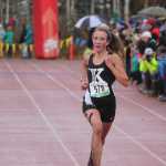 Photo by Joey Klecka/Peninsula Clarion Kenai Central sophomore Riana Boonstra closes in on the finish line to take second place in Saturday's Class 4A girls state championship race at Bartlett High School in Anchorage. The Kenai girls won their first cross-country team championship in school history.