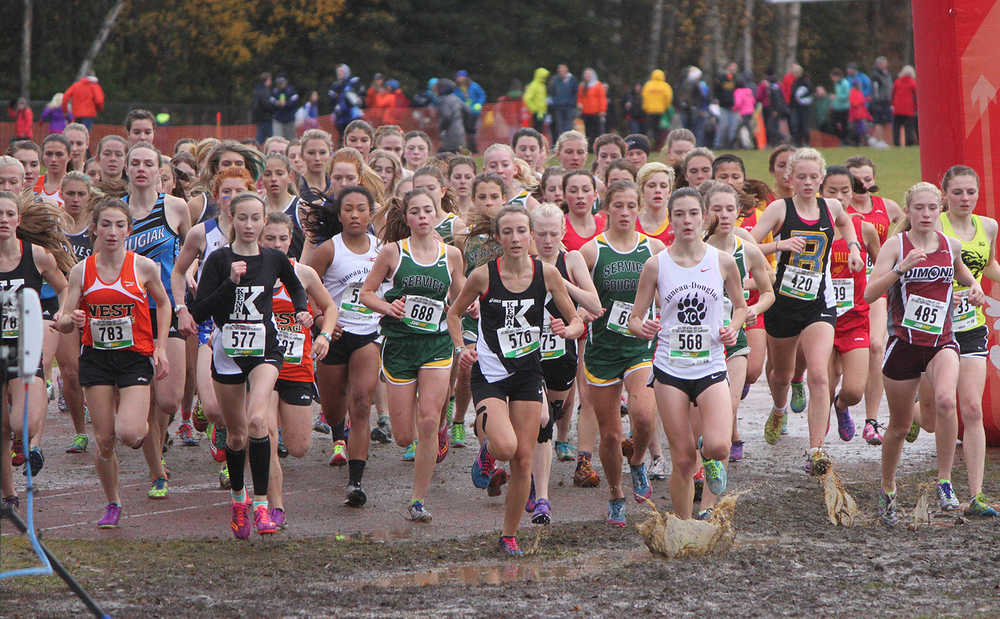 Kenai girls: Photo by Joey Klecka/Peninsula Clarion Kenai Central freshman Jaycie Calvert (577) and sophomore Riana Boonstra (576) lead the charge in Saturday's Class 4A girls state championship race at Bartlett High School in Anchorage. The Kenai girls won their first cross-country team championship in school history.