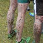 Photo by Joey Klecka/Peninsula Clarion Mud adorns the legs of Seward junior Hunter Kratz after Saturday's Class 123A boys state championship race at Bartlett High School in Anchorage. Kratz finished second to lead the Seward boys.