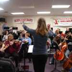 Photo by Megan Pacer/Peninsula Clarion Kenai Peninsula Orchestra Artistic Director Tammy Vollom-Matturro conducts local musicians in a practice on Thursday, Oct. 1, 2015 at Kenai Central High School.