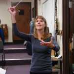 Photo by Megan Pacer/Peninsula Clarion Kenai Peninsula Orchestra Artistic Director Tammy Vollom-Matturro leads orchestra members in a run-through of their concert on Thursday, Oct. 1, 2015, at Kenai Central High School.
