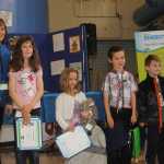 Students claim prizes in HEA's energy contest.