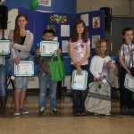 Students claim prizes in HEA's energy contest.