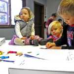 (From right) Aliya, Maisy and Isaiah Dickson work on Isaiah's project for the IDEA homeschool group's geography club weekly meetup Friday.