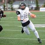 Photo by Rashah McChesney/Peninsula Clarion Nikiski quarterback Dennis Anderson makes a run during their small schools state championship game against Eielson High School on Saturday Oct. 17, 2015 in Anchorage, Alaska.