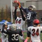 Timmy Smithwick bats away a fourth down, fourth quarter pass from Kenai's Andrew Welborn.  Photo for the Clarion by Michael Dinneen