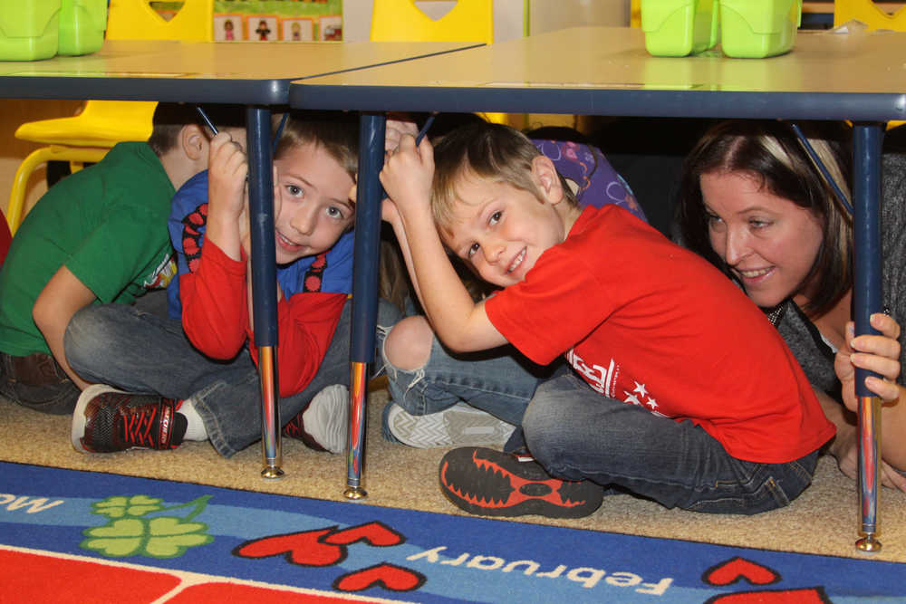 Kids drop and head for cover as drill begins.