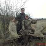 Jackson (front) and Tad Covault pose with the moose Jackson shot down north of the Yukon River in September.