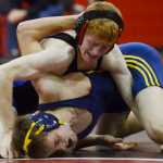 Photo by Kelly Sullivan/ Peninsula Clarion In this November 25, 2014 file photo,  Soldotna High School Star Talon Musgrave struggles against Homer Mariner Julien Richburg in the 145-pound weight class match during the Luke Spruill Memorial Wrestling Tournament at Kenai Central High School in Kenai, Alaska.