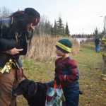 Photo by Megan Pacer/Peninsula Clarion Soldotna resident Jan Slegers checks on the progress of his 6-year-old son, Jake, as they make their way through the Trick or Treat Trail on Sunday, Oct. 25, 2015 during the annual Spook Night Trick or Treat and Zombie 5K at the Tsalteshi Trails in Soldotna, Alaska.