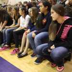 Photo by Kelly Sullivan/ Peninsula Clarion Cyanna Lindquist, Shae Breff and Zaharah Wilshusen watch speaker Michael Patterson talk about his experience smoking cigarettes during an assembly Wednesday, Oct. 28, 2015, at Kenai Middle School in Kenai, Alaska.