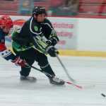 Photo by Rashah McChesney/Peninsula Clarion Kenai River Brown Bear Tanner Dufault outmaneuvers an Aston Rebels player during their game on Friday October 30, 2015 in Soldotna, Alaska.